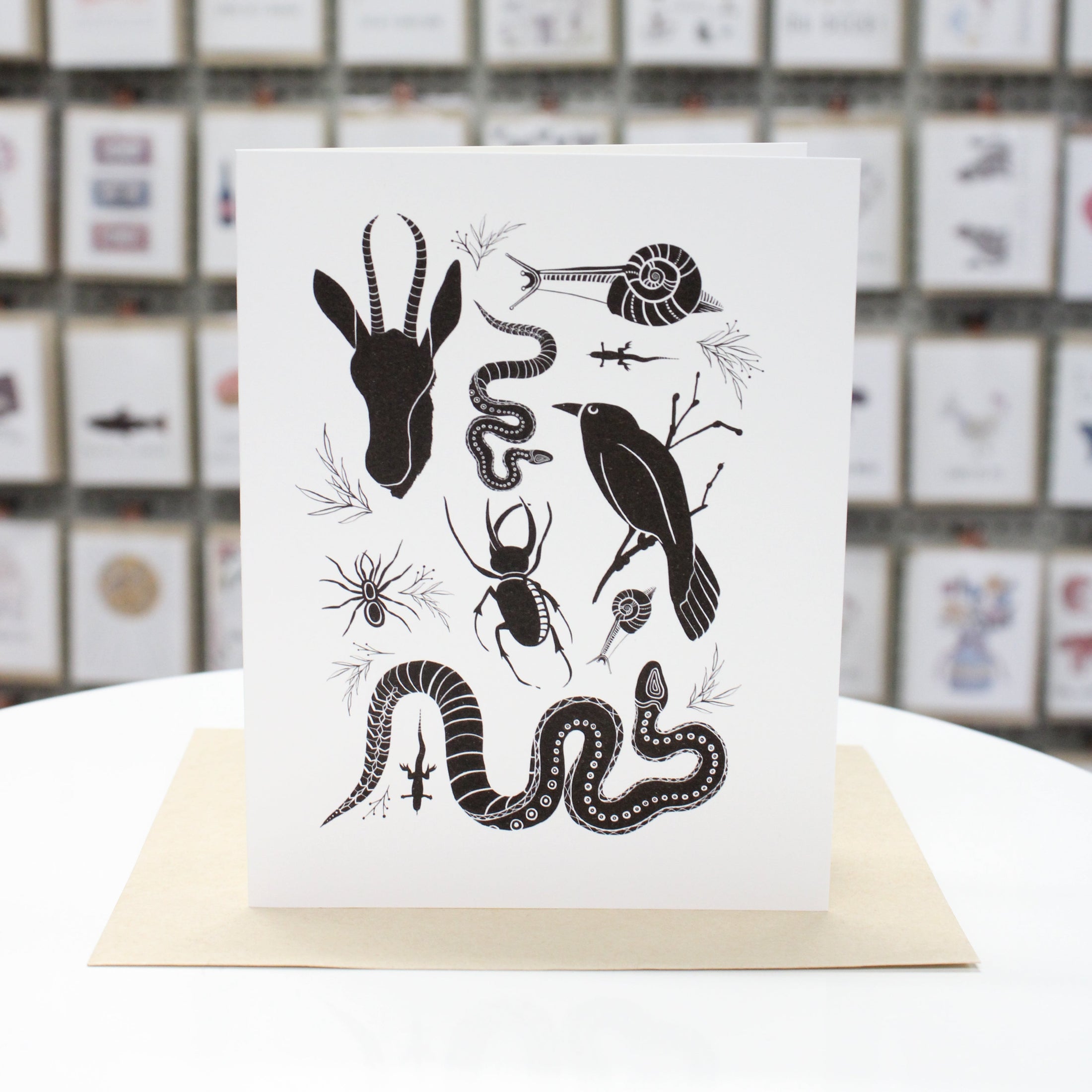 handcrafted greeting card with antelope, snail, snake, raven, spider, beetle. 