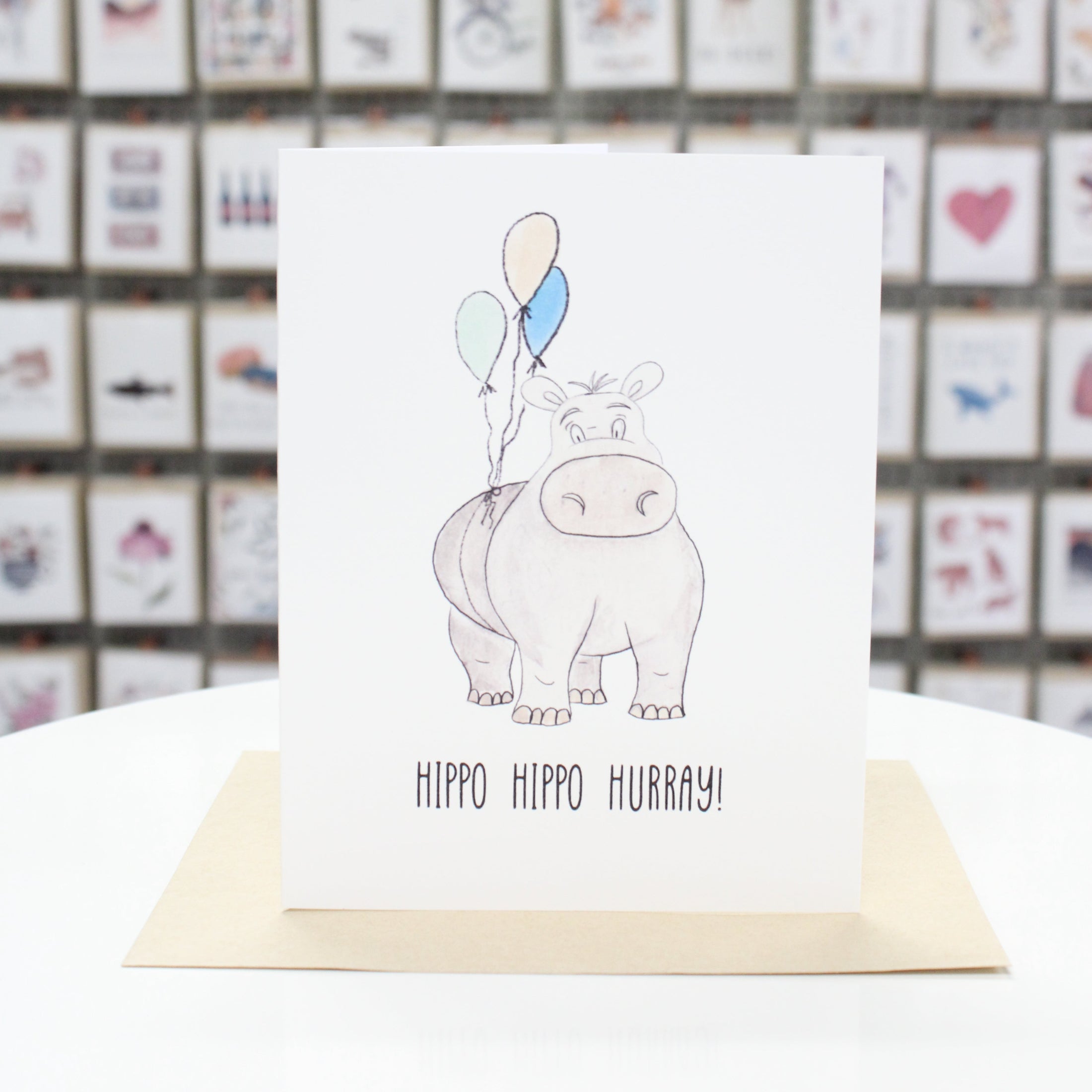 Hand crafted birthday card with hand drawn hippo and balloons. Card stating, "Hippo Hippo Hurray!"