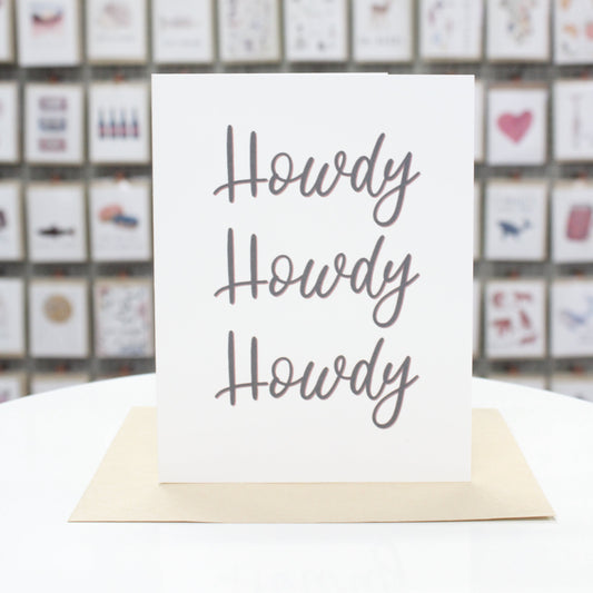 Hand crafted greeting card with printed calligraphy lettering stating, "Howdy Howdy Howdy." 