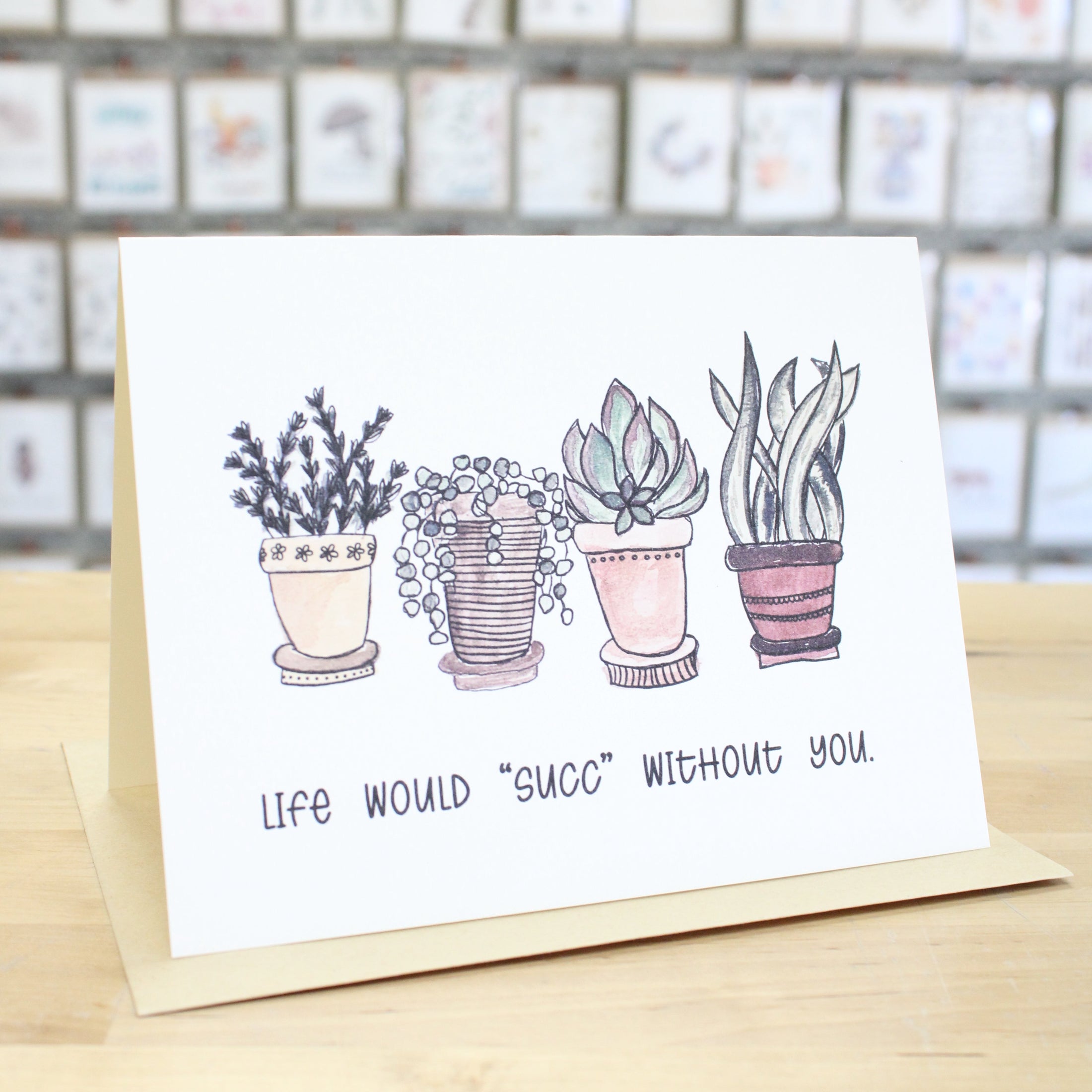 Hand crafted greeting card with different hand drawn, colored potted plants. Card states, "Life Would Succ Without You."